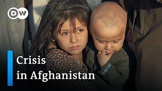 What impact does the humanitarian crisis in Afghanistan have on the newly formed Taliban regime?
