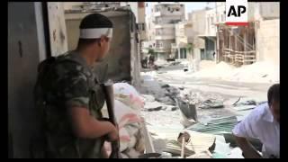 Free Syrian Army fighters battle with govt soldiers in streets of Aleppo