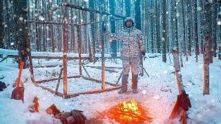 Building of a winter camp in the wild forest. Part 1. Cooking over a fire.