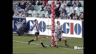 Nathan Buckley kicking an amazing goal in the wet!