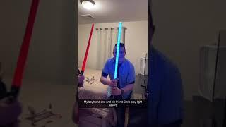 christopher and igor having a lightsaber duel