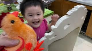 Misa with daddy have fun with toy chicken