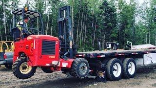 LOADING MOFFETT PIGGYBACK ON FLATBED TRAILER