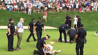 Protesters at Travelers Championship tackled by police after running onto 18th green