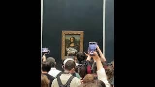 Bizarre incident at the Louvre Museum in Paris - a man in disguise smeared a cake over the Mona Lisa