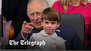 Mischievous Prince Louis sits on Prince Charles' lap during Queen's Platinum Jubilee Pageant