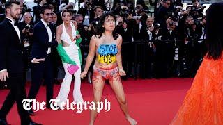 Semi-naked Ukraine protesters storms Cannes red carpet