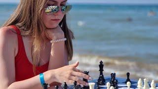 Fatality and Pinkamena  playing chess to the sound of the sea 