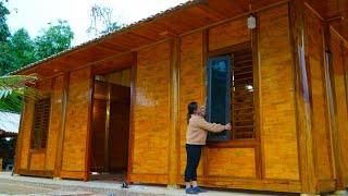 Completed wooden house construction. Went to the village to buy pork to celebrate the workers