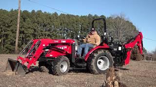 Digging Up a Tough Tree Stump. TYM Tractors