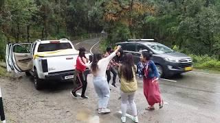 Girls Dancing in the Rain. That's why you should go on Dharamshala Trip.