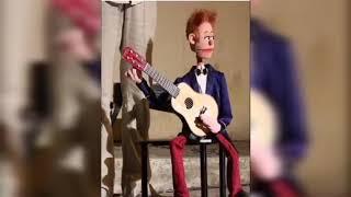 Funny puppet show playing guitar