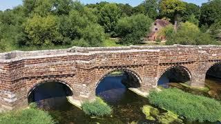 STURMINSTER MARSHALL MEDIEVAL BRIDGE - drone view                                        2022 Aug 11