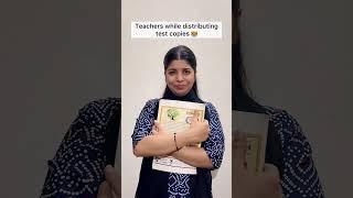Teachers while distributing test copies ‍ | Anjali Sinha