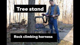 hunting from rock climbing harness in tree stand