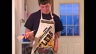 A Young MeMyselfAndPi and his brother baking a cake