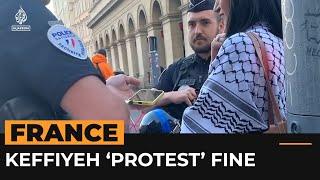 Woman detained by French police over Palestinian scarf
