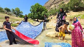 "Family Fun Day: Washing Rugs and Blankets by the River!"