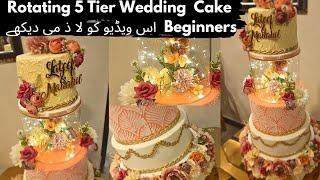 Complete guide about 5 Tier Rotating Wedding Cake by Fatima Cuisine | Trending Rotating Cake