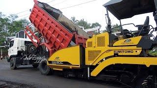 Asphalt Paver Sumitomo HA60C And Dump Truck Working