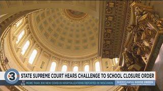 State Supreme Court hears challenge to school closure order