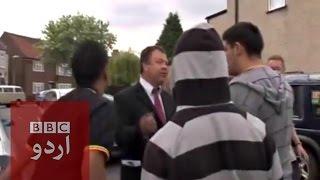 Asian men and BNP candidate Bob Bailey fist fight.