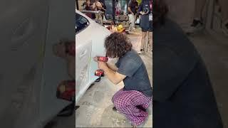 Akira Nakai cutting a Porsche