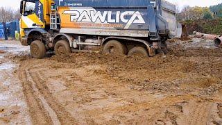 The truck driver didn't expect this! Trucks deliver cargo in harsh off-road conditions.