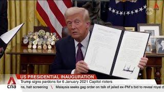 Trump signs raft of executive orders, revokes dozens of Biden's directives