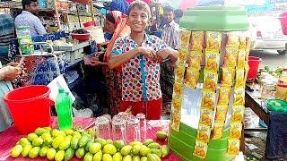 Hard Working Small Boy Selling street food Lemon Juice & Orange Drinks on the Street