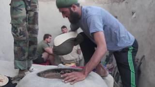 Afghan Soldiers teach US Marines how to cook Afghan food in Sangin Afghanistan 2010