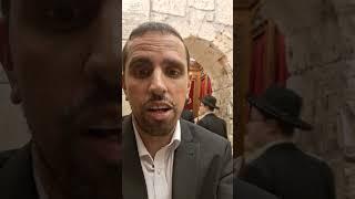 Arch inside the Western wall surrounded by Torah books at the Kotel