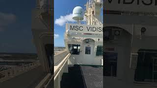 Container ship in Port @ Freeport, Grand Bahamas… Clear blue skies and pristine blue waters …