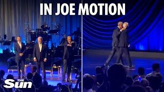 Embarrassing moment Joe Biden appears to FREEZE again before Barack Obama pulls him off-stage