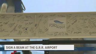 Gerald R. Ford is asking for community to sign a beam that will be used in expansion construction