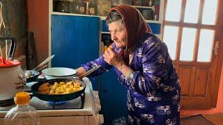 Hard life in the mountains. An elderly grandmother 86 years old, lives alone in the village