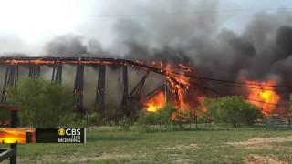 Watch: Fiery collapse of railroad trestle