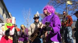 Mardi Gras parade marches through downtown Lawrence