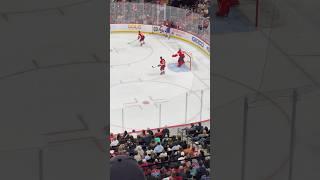 Montreal Canadiens Josh Anderson passes to Sean Monahan who shoots, Jake Evans buzzing the goalie