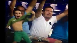 an incredible and weird Joy of a child watching himself on the screen -World cup 2014