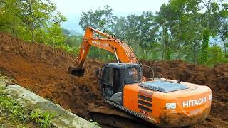 The Excavator Operator Have To Dig Wet Clay And Dirt To Build Wider Road