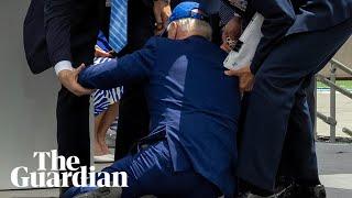 Joe Biden falls on stage at US air force academy ceremony