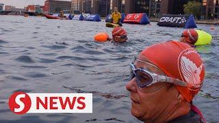 Swimmers take on Copenhagen harbour by night