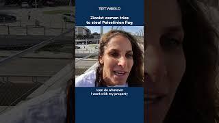 Zionist woman attempts to steal Palestinian flag from protesters