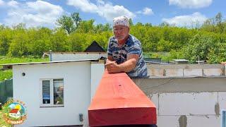 We are building a house in the village! A man is building a roof alone