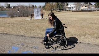 MANUAL WHEELCHAIR CONVERTED INTO A POWERCHAIR WITH WORLDS LIGHTEST POWER ADD-ON UNIT!! (SMART-DRIVE)