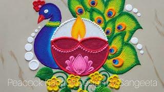 2 Simple and beautiful peacock rangoli design with colours l rangoli by using coils l साधारण रंगोली