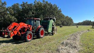 Kubota m5-111 baling hay with a John Deere 450e 4x5 round baler