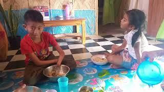 Immanuel and nzanbeni having their dinner together