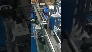 Wrap around labeling machine